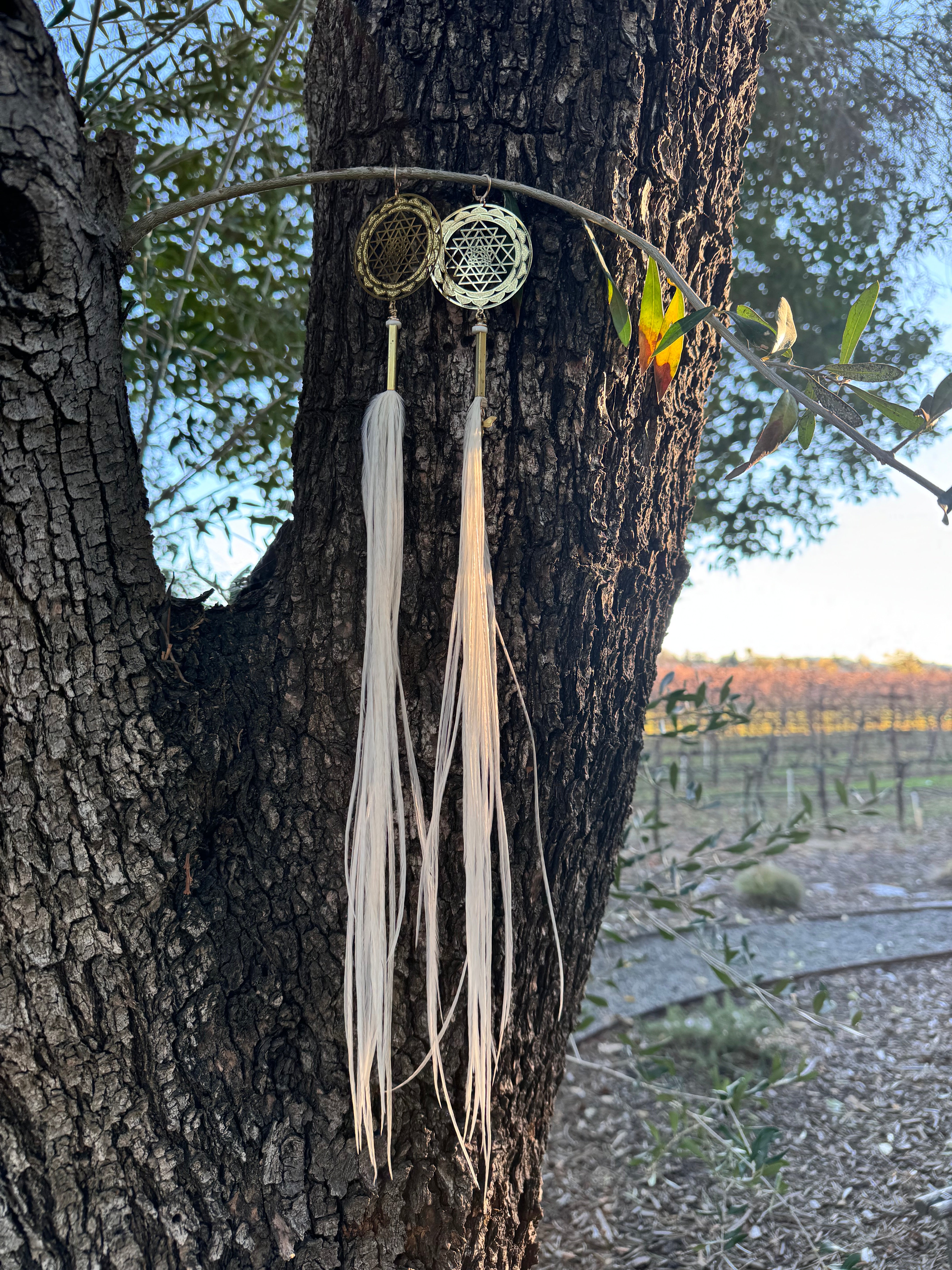 Sacred Sri Yantra white feather earrings